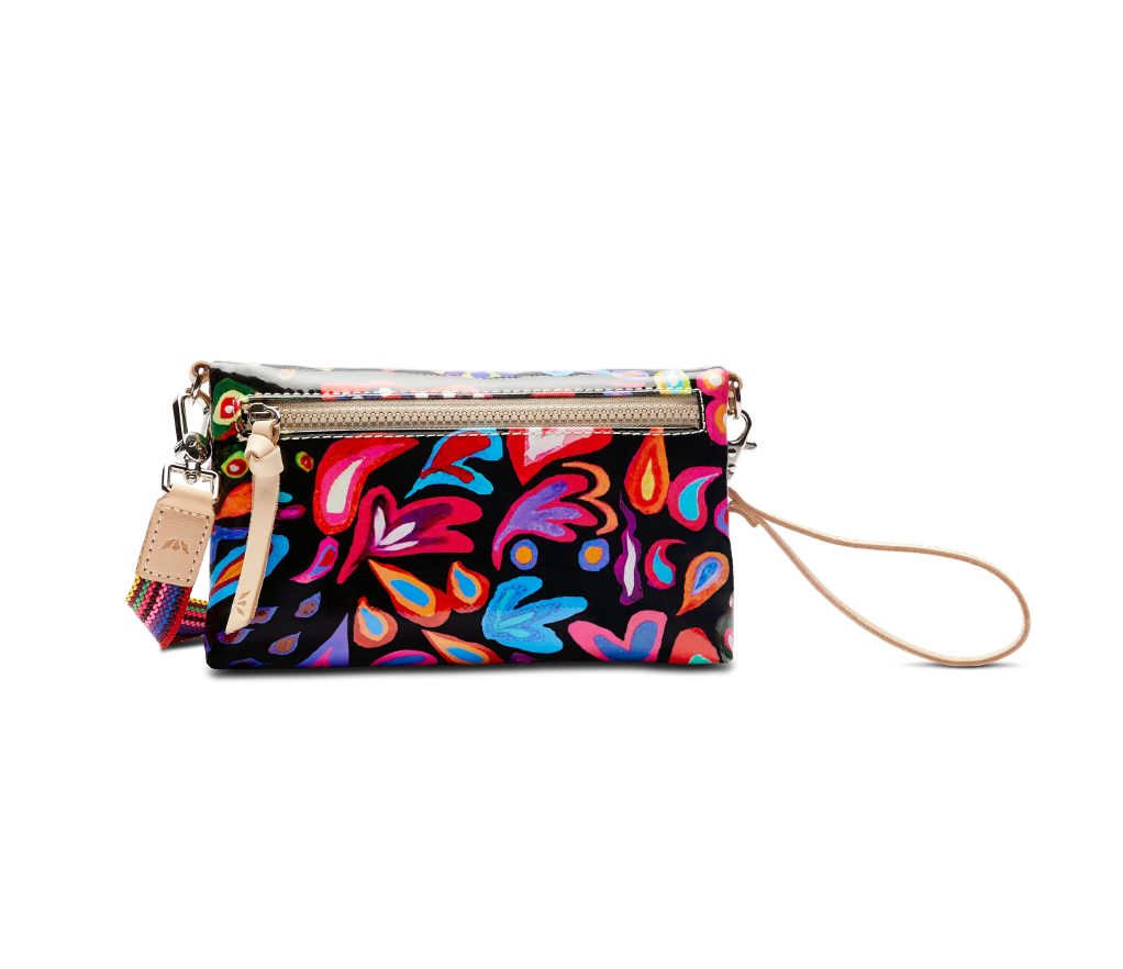 Consuela Sophie Crossbody Bag with colorful floral pattern and wrist strap for easy carrying