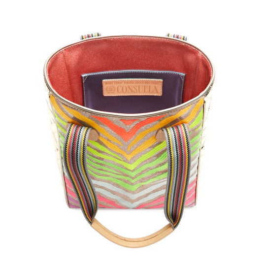 Top view of Consuela Veronica Chica Tote with colorful striped handles and vibrant patterned interior