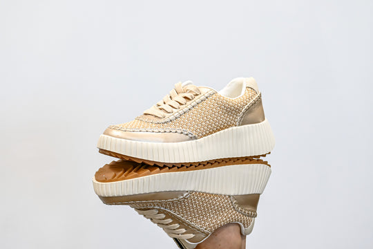 ShuShop gold sneaker fashion with textured design and thick white sole for trendy casual wear