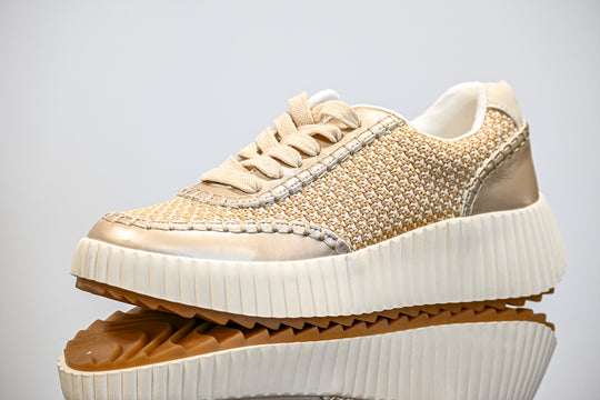 ShuShop gold sneaker fashion with woven upper and thick white sole for stylish comfort