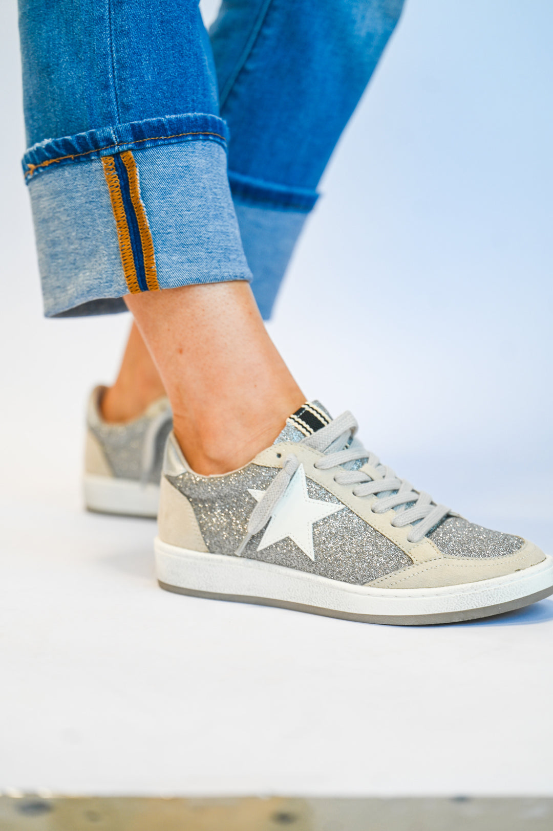 ShuShop Paz Glitter Sneaker in silver sparkle with white star detail and light gray laces